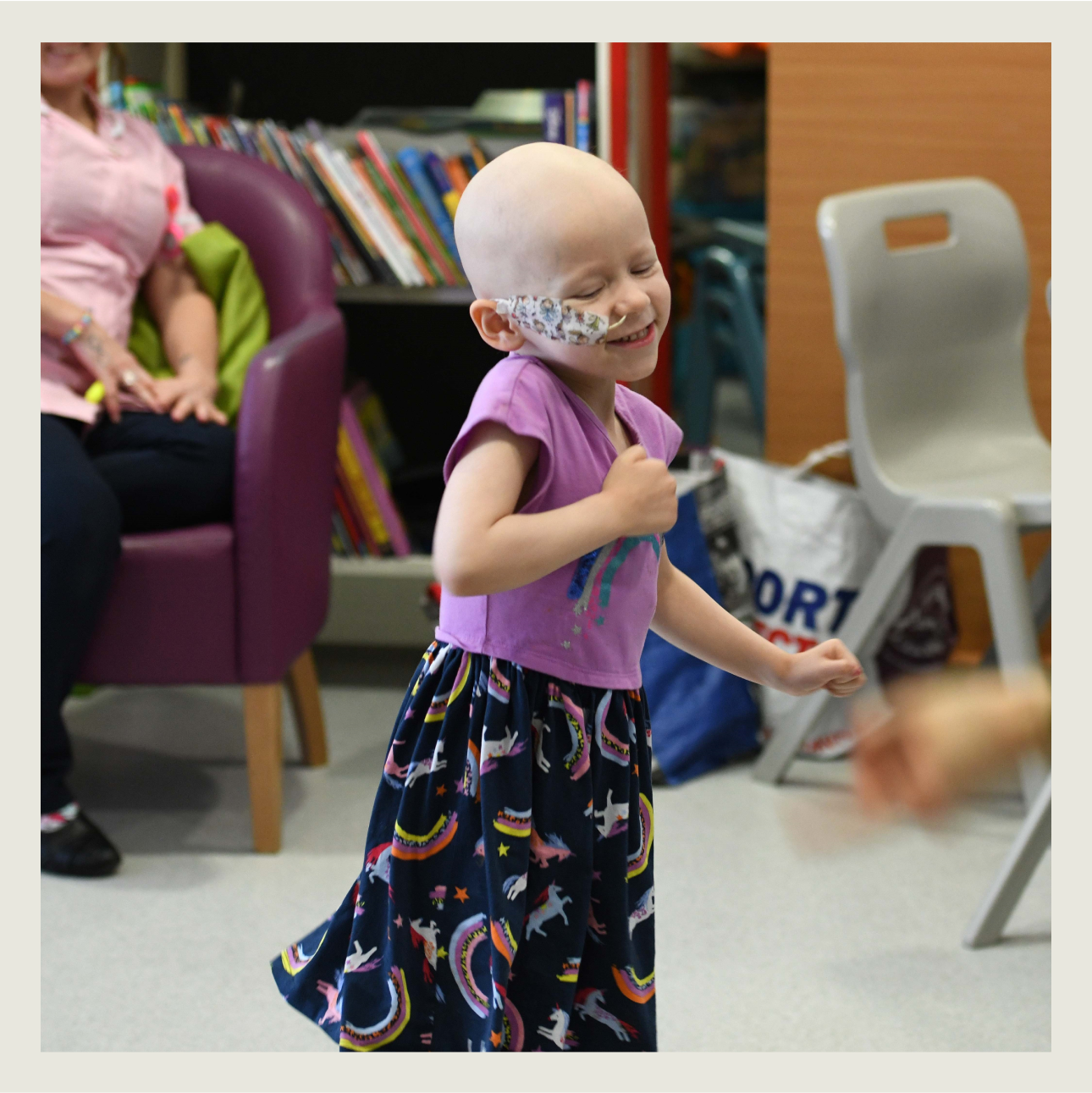 A child looking happy whilst receiving medical treatment. 